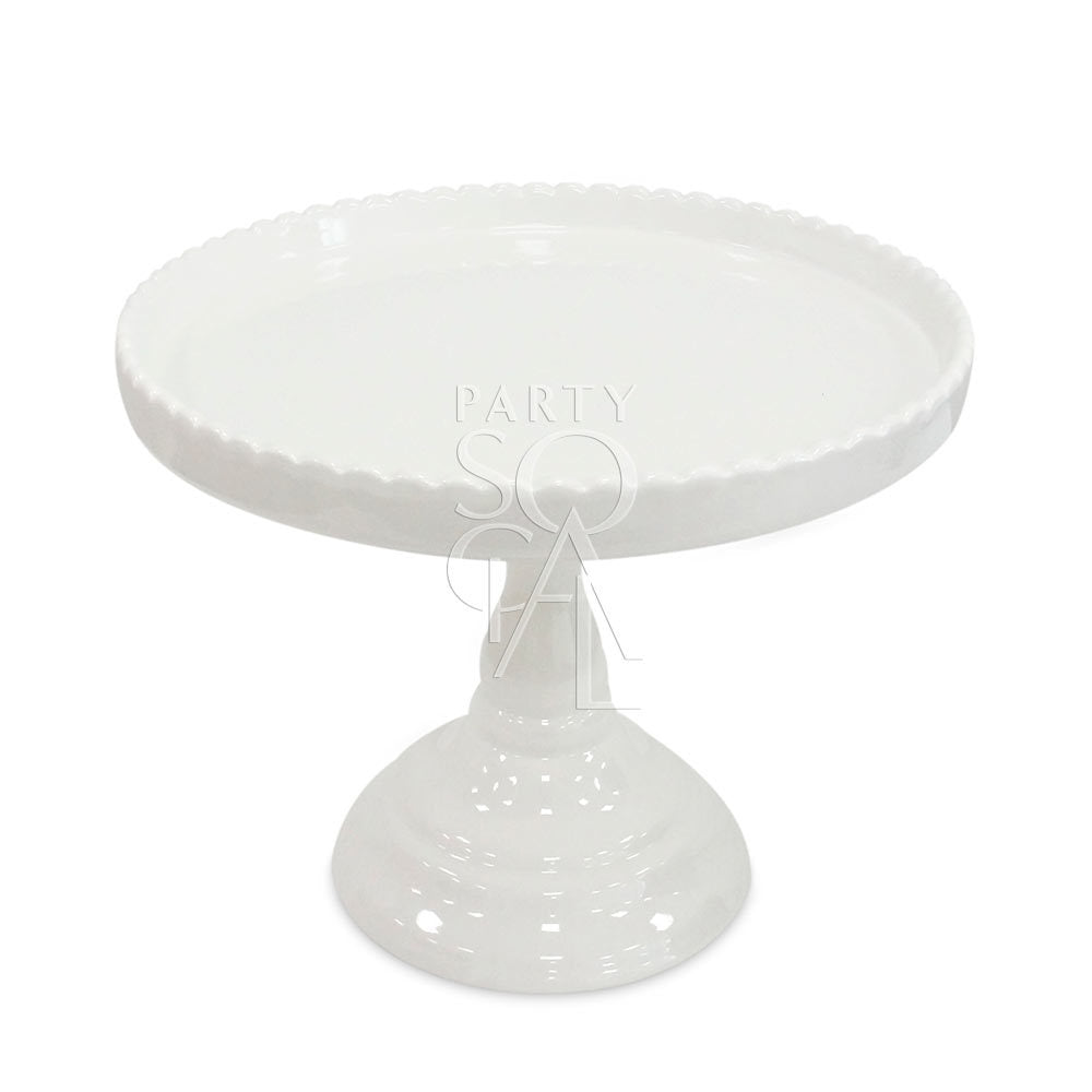 Porcelain cake stand with scalloped edge, ideal for showcasing cakes or creating elegant centerpieces. Perfect for enhancing any special occasion setting.