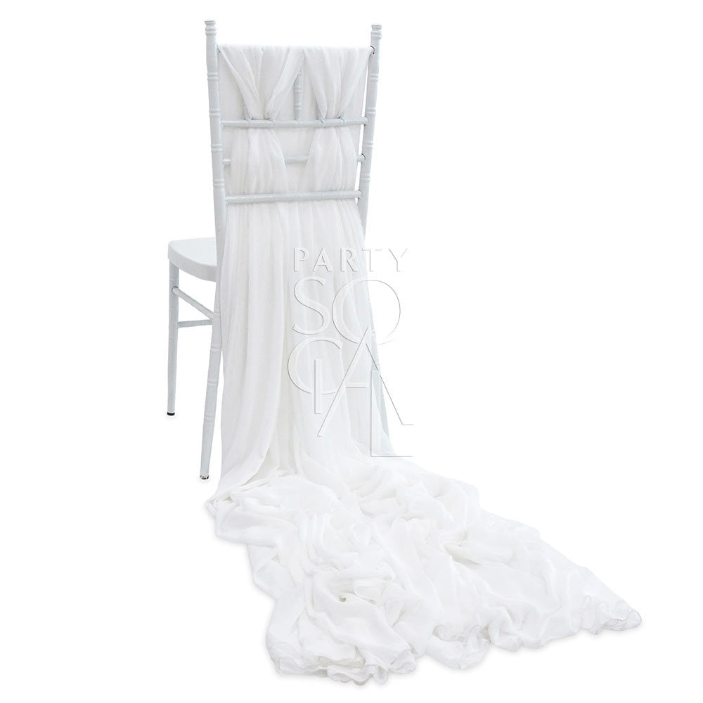 White chiffon chair cover with a train, custom-made for Chiavari chairs, offering an elegant and whimsical touch for event decor.