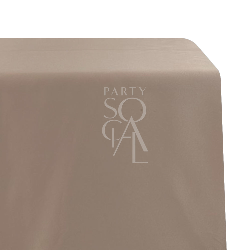 Rectangular satin tablecloth, perfect for special occasions, showcasing a logo detail. Ideal for enhancing your event&