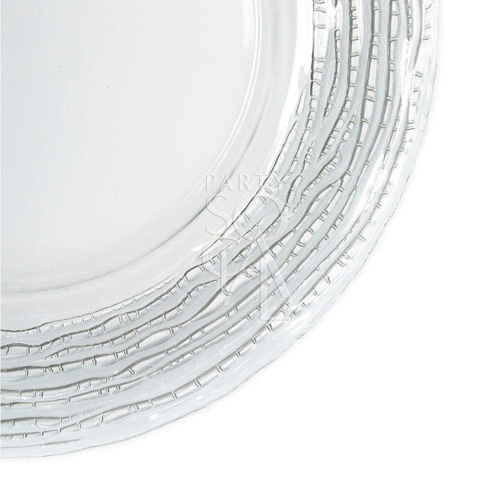 CHARGER PLATE - GLASS SILVER RUFFLE: A stack of clear, intricately ruffled glass plates, perfect for adding elegance to weddings or glamorous events.