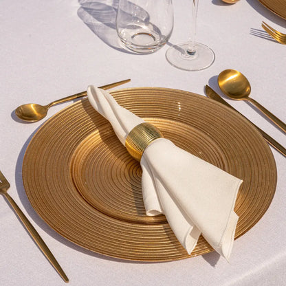 CHARGER PLATE - GOLD LINED enhances a formal table setting with elegant gold flatware and napkin ring, showcasing refined luxury for special occasions.