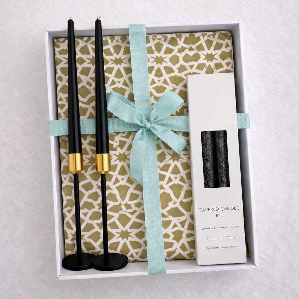 Noir & Gold Signature Gift Box features black candlesticks with gold holders, black tapered candles, and decorative backing, ideal for elegant Ramadan celebrations.