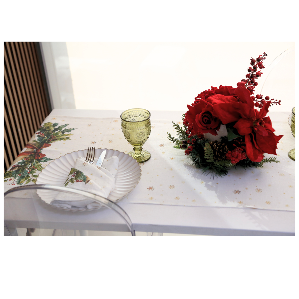 Winter Vine Linen Runner graces a festive table setting with gold snowflakes and holly motifs, complemented by elegant dinnerware and a holiday floral centerpiece.