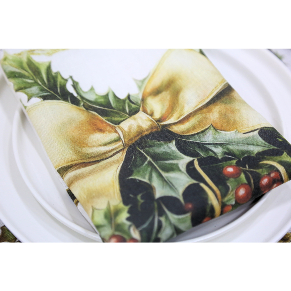 Golden Carol Linen Napkin, festive holly and berries print, tied with a golden ribbon, elegantly enhances your Christmas table setting.