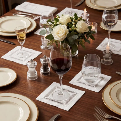 Classic Border Pure Linen Coaster in a set of four, displayed with matching white hem-stitched placemat and napkins, showcasing elegant tableware for special occasions.