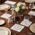 Classic Border Pure Linen Coaster in a set of four, displayed with matching white hem-stitched placemat and napkins, showcasing elegant tableware for special occasions.