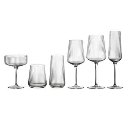 Clear Lined Glassware Collection: Six elegantly ribbed glasses including coupe, tumblers, wine glasses, and champagne flute, perfect for upscale events and entertaining.