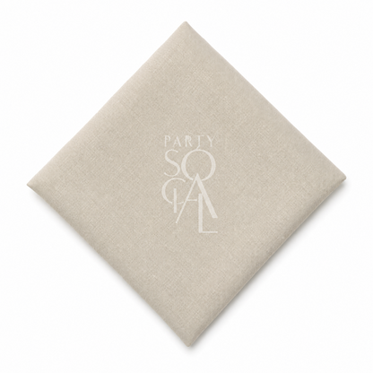 A square beige linen napkin displayed diagonally on a clean white background.