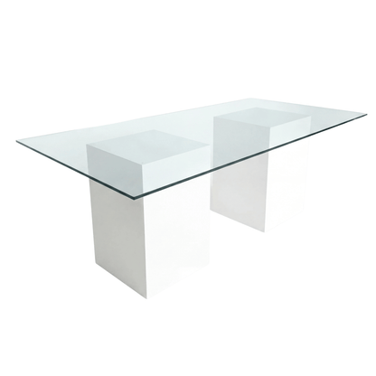 GLASS DINING TABLE with a clear glass top and white block supports, ideal for corporate and home events, offered by Party Social. Dimensions: 240cm x 130cm x 75cm.