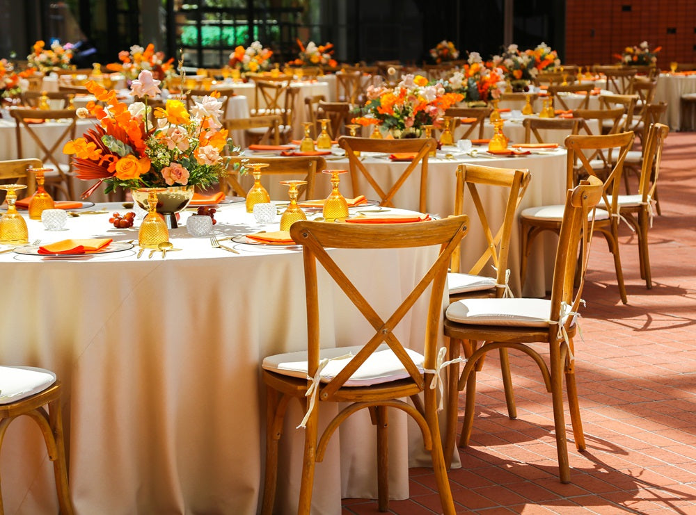 CROSSBACK CHAIR OAK WOOD at a wedding table setup, showcasing its vintage style, ideal for events like weddings and corporate functions.