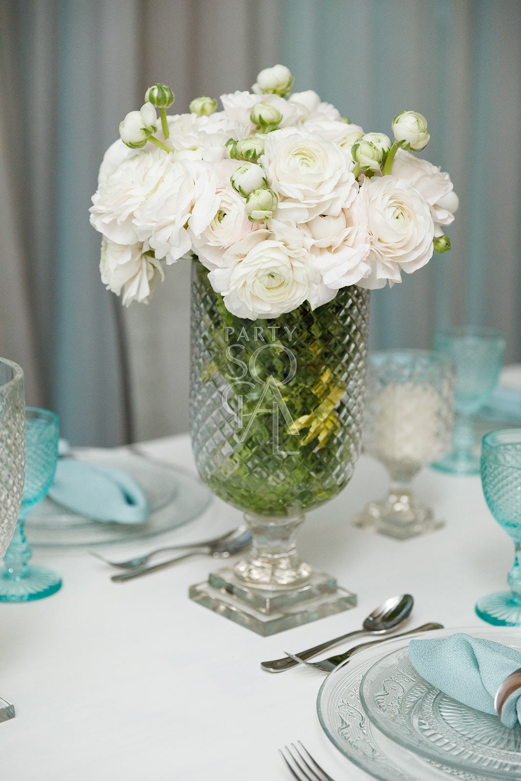 Crystal Cut Vases on a table, featuring elegant floral arrangements as a centerpiece, showcasing their classic design suitable for enhancing party and event decor.