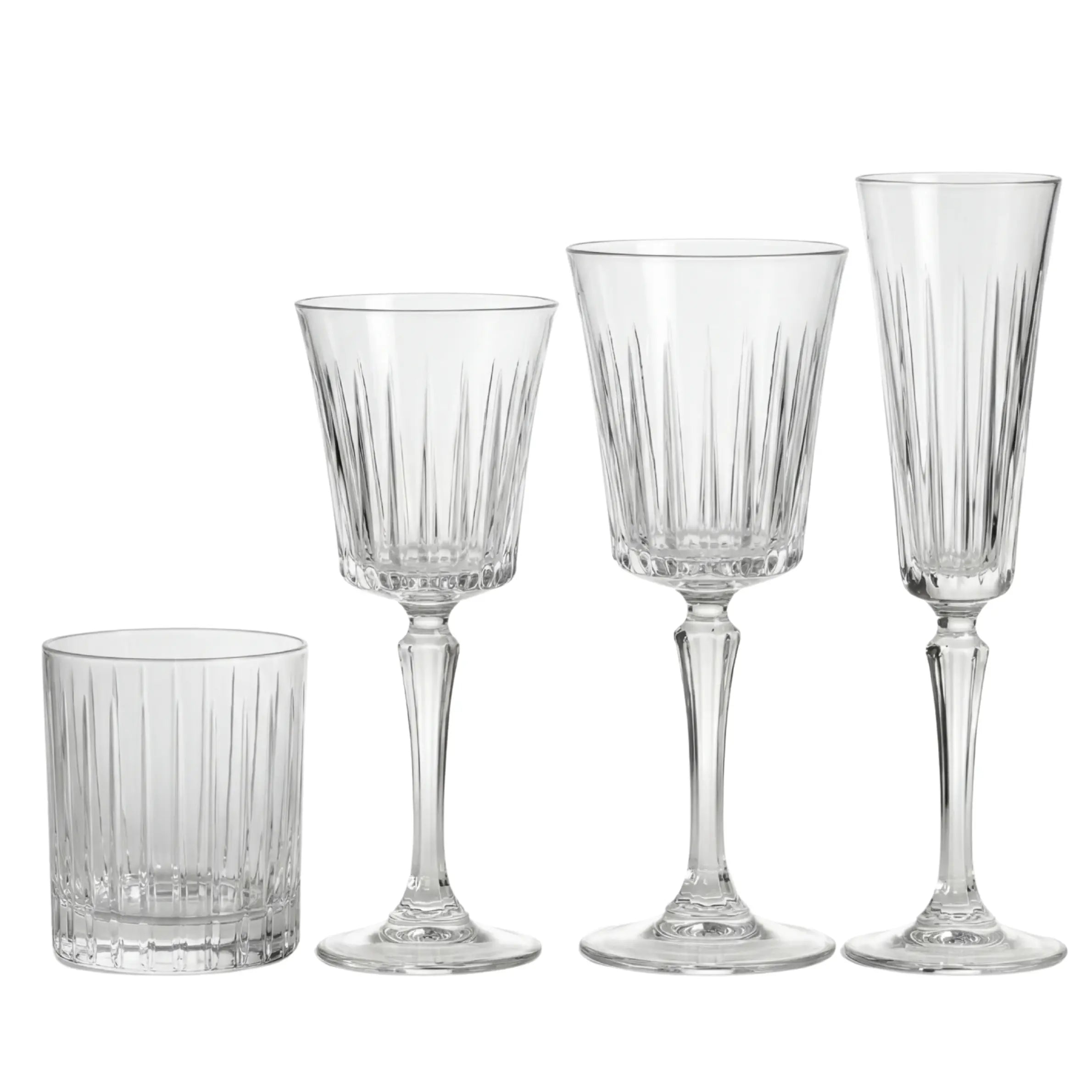 Crystal Paris Glassware Collection: Four ribbed glass pieces—tumbler, white wine, red wine glasses, and champagne flute—ideal for elegant gatherings and upscale events.