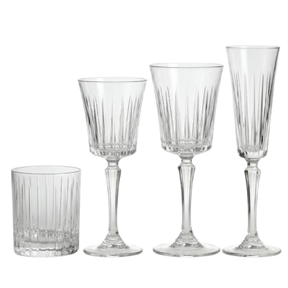 Crystal Paris Glassware Collection: Four ribbed glass pieces—tumbler, white wine, red wine glasses, and champagne flute—ideal for elegant gatherings and upscale events.