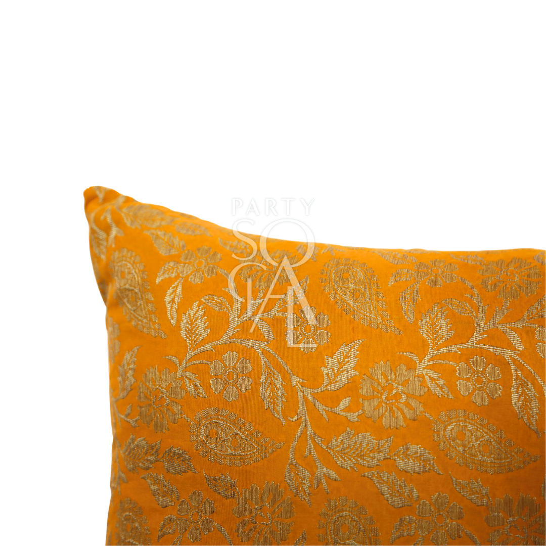 CUSHION COVER BROCADE: Close-up of a premium brocade fabric cushion cover, showcasing intricate textile patterns. Perfect for enhancing event decor.