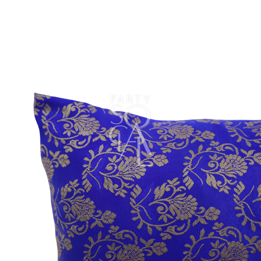 CUSHION COVER BROCADE: Blue pillow with gold floral design in premium brocade fabric, ideal for adding elegance to party or event decor.