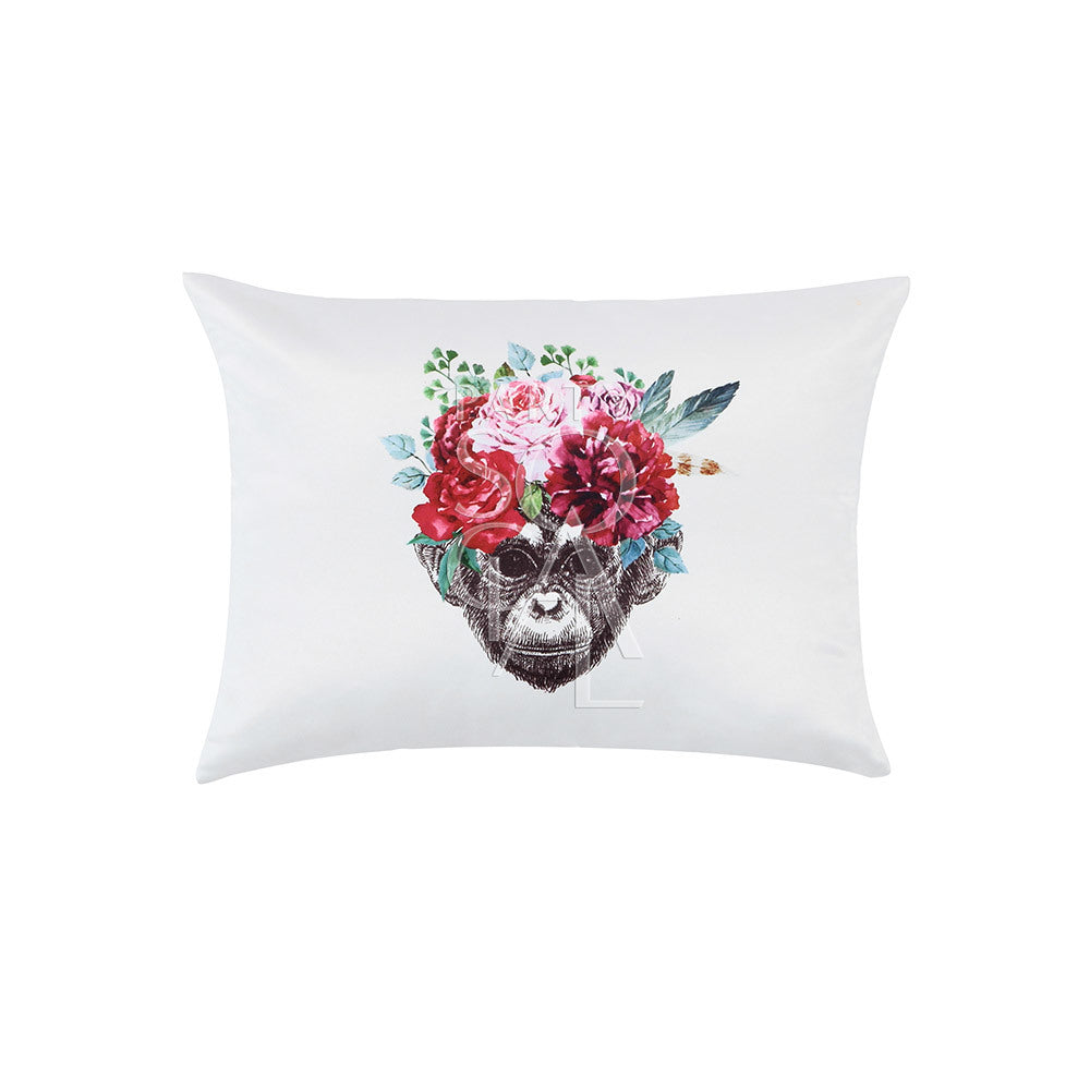CUSHION OFF WHITE W/ MONKEY FACE: Satin throw pillow featuring a central monkey face surrounded by floral designs. Ideal for party-themed decor or event settings.