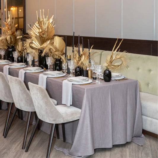 Rectangular Tablecloth Linen Blend drapes elegantly over a formally set dining table, complemented by matching napkins and refined decor, ideal for sophisticated event settings.