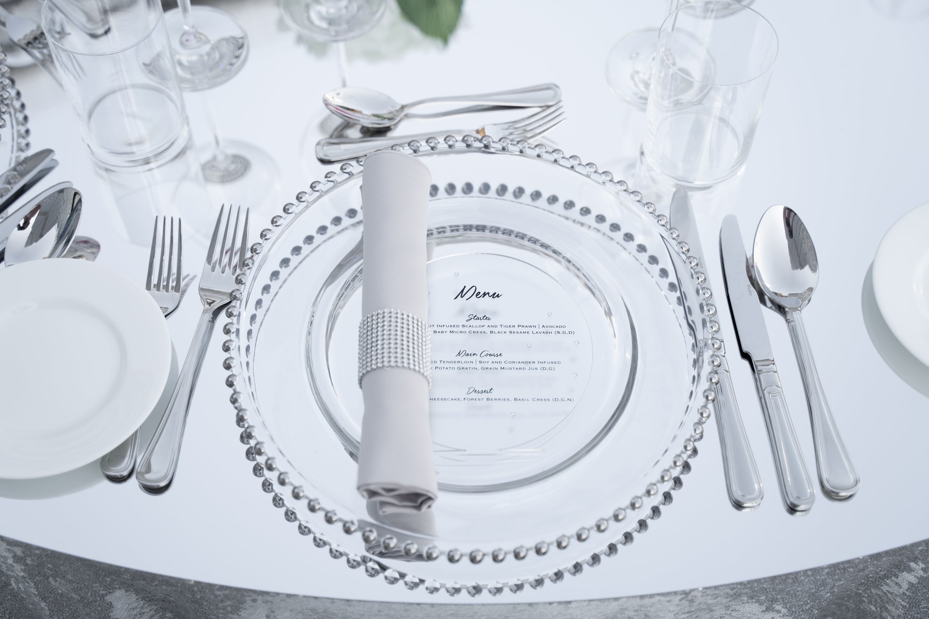 Cutlery Simple Silver set displayed with a napkin and silverware on a table, ideal for enhancing any party or event setting.