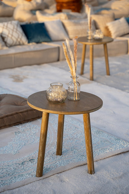 Wooden coffee table featuring vases and decorative glass jars, ideal for enhancing indoor or garden party settings.