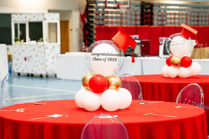 Balloon Tabletop Decor with customizable white balloons on a red table, ideal for graduation parties, offered by Party Social.