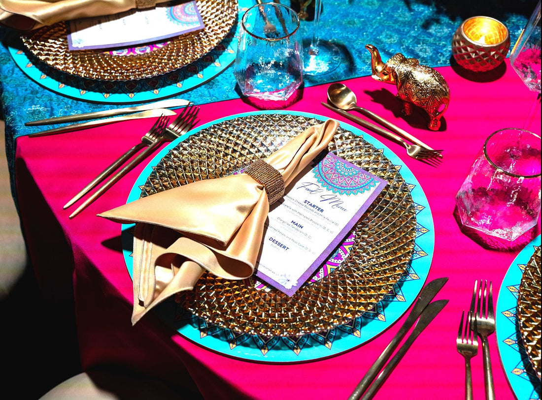 Gold beaded napkin ring on a table setting with silverware and glass, ideal for enhancing elegant event decor.