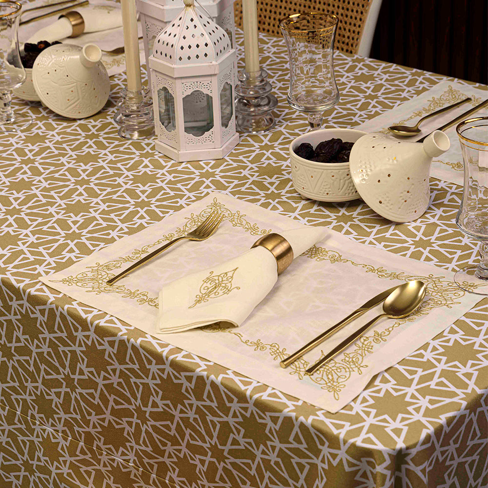Geometric patterned tablecloth with tableware and utensils.