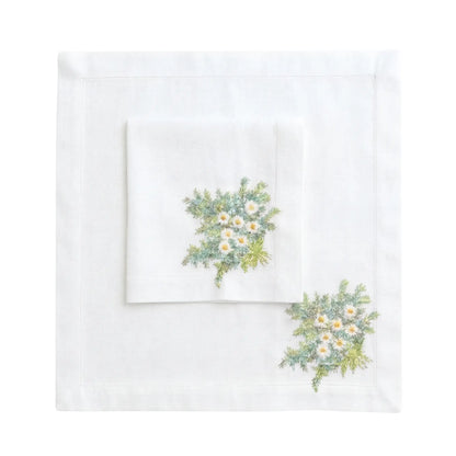 Daisy Pure Linen Dinner Napkin set features two white linen napkins with embroidered daisy sprays, ideal for elegant table settings at special events.