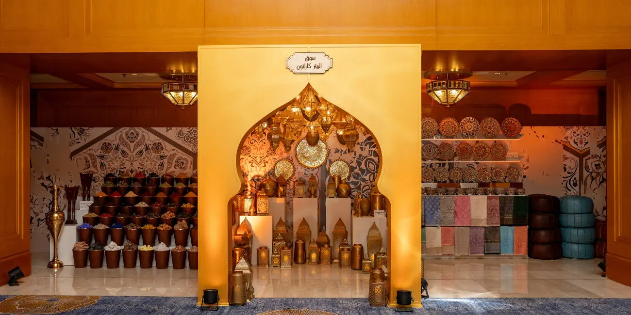 Decorative interior with shelves displaying various items against a yellow wall.