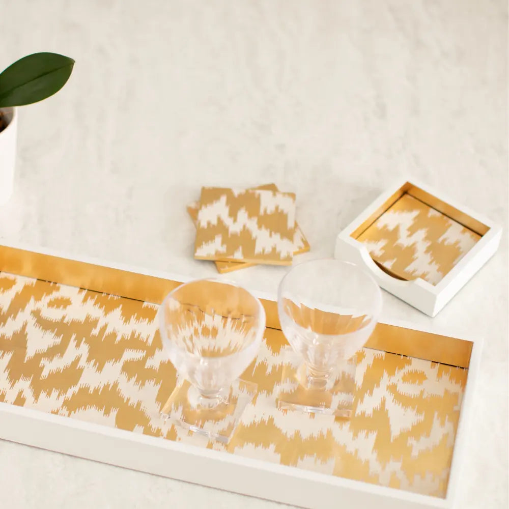 Decorative table runner with geometric pattern coaster on a white surface