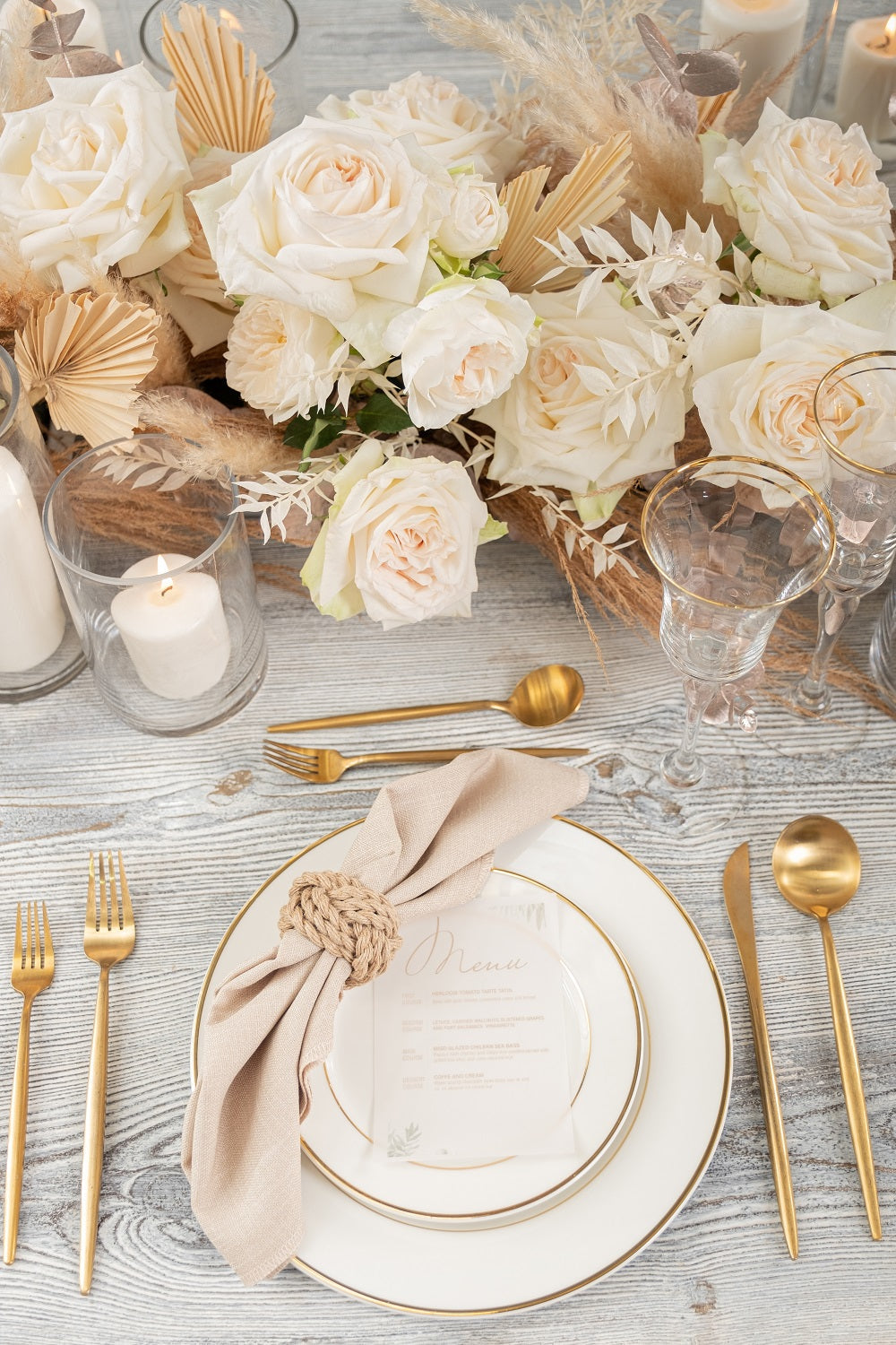 Modern China w/ Gold Rim Plates on an elegant table setting with gold cutlery and white rose centerpiece, ideal for premium events and special occasions.