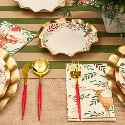 Bella Cutlery in Gold and Red by Sophistiplate displayed on a table with plates, a napkin, and a fork, perfect for elegant events.