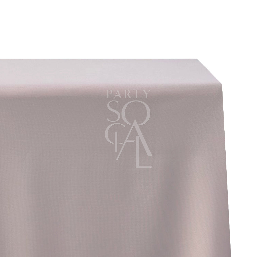 Rectangular tablecloth in cotton linen featuring a subtle logo, perfect for enhancing any special occasion setting.