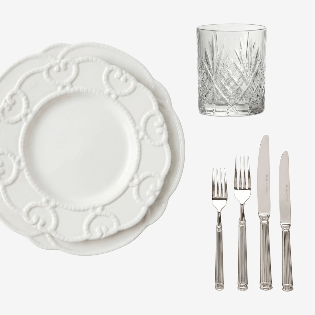 Embossed Tabletop Package: White plates with scroll pattern, crystal tumbler, and silver-tone cutlery set for elegant dining from Party Social.