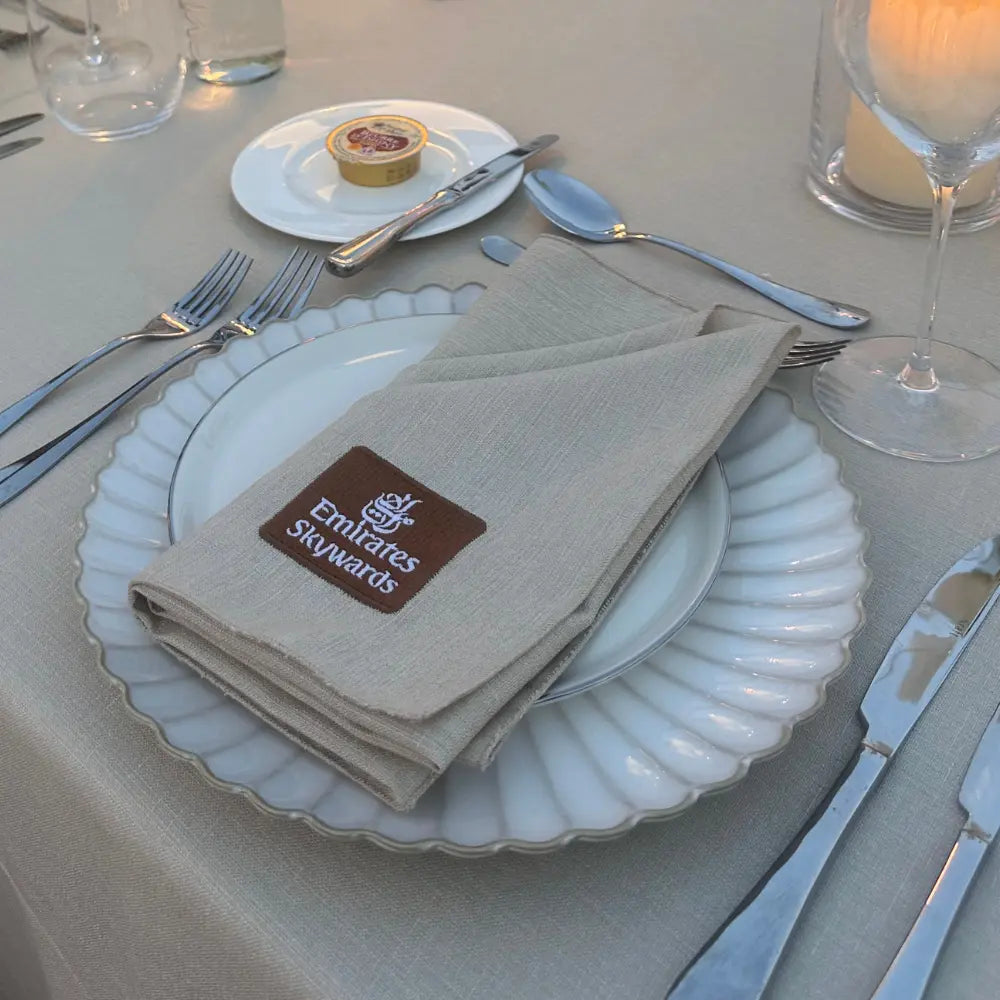 Table setting with Emirates Skywards napkin on a white plate