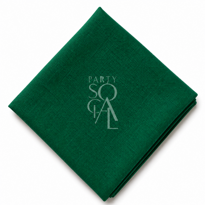 A square emerald linen napkin displayed diagonally on a clean white background.
