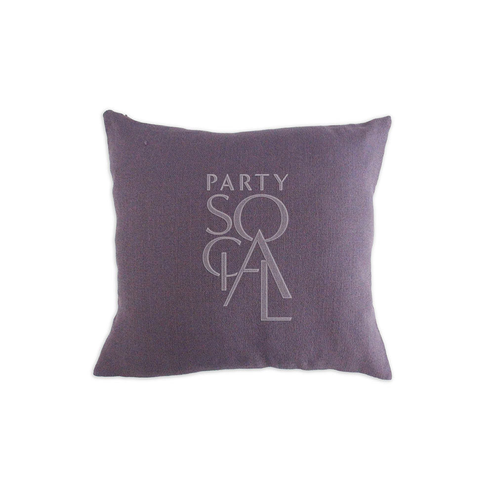 CUSHION COVER LINEN WEAVE with a logo, showcased on a purple pillow. Premium fabric, perfect for enhancing party decor and comfort.