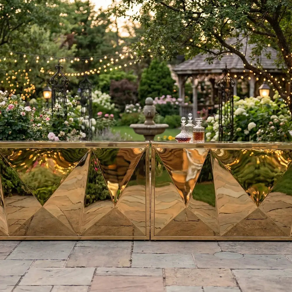 Mirror Bar Unit in an elegant garden, featuring faceted gold panels and glass decanters, ideal for upscale events and glamorous gatherings.