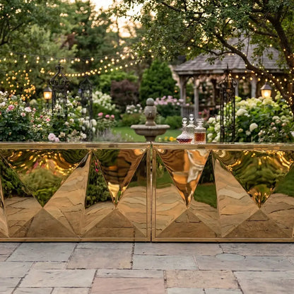 Mirror Bar Unit in an elegant garden, featuring faceted gold panels and glass decanters, ideal for upscale events and glamorous gatherings.