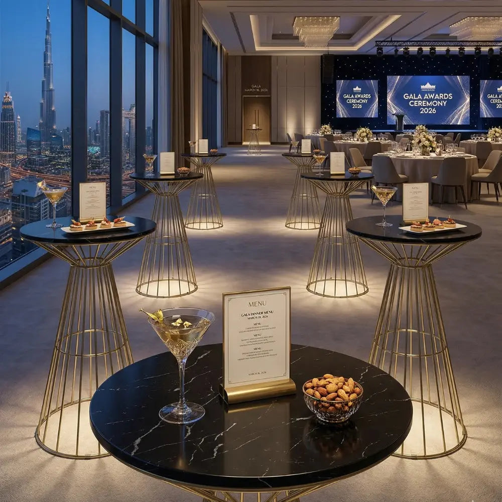 GOLD WIRE COCKTAIL TABLE-BLACK MARBLE TOP featured at Gala Awards Ceremony 2026, elegantly set with a menu card, cocktail glass, and hors d’oeuvres.