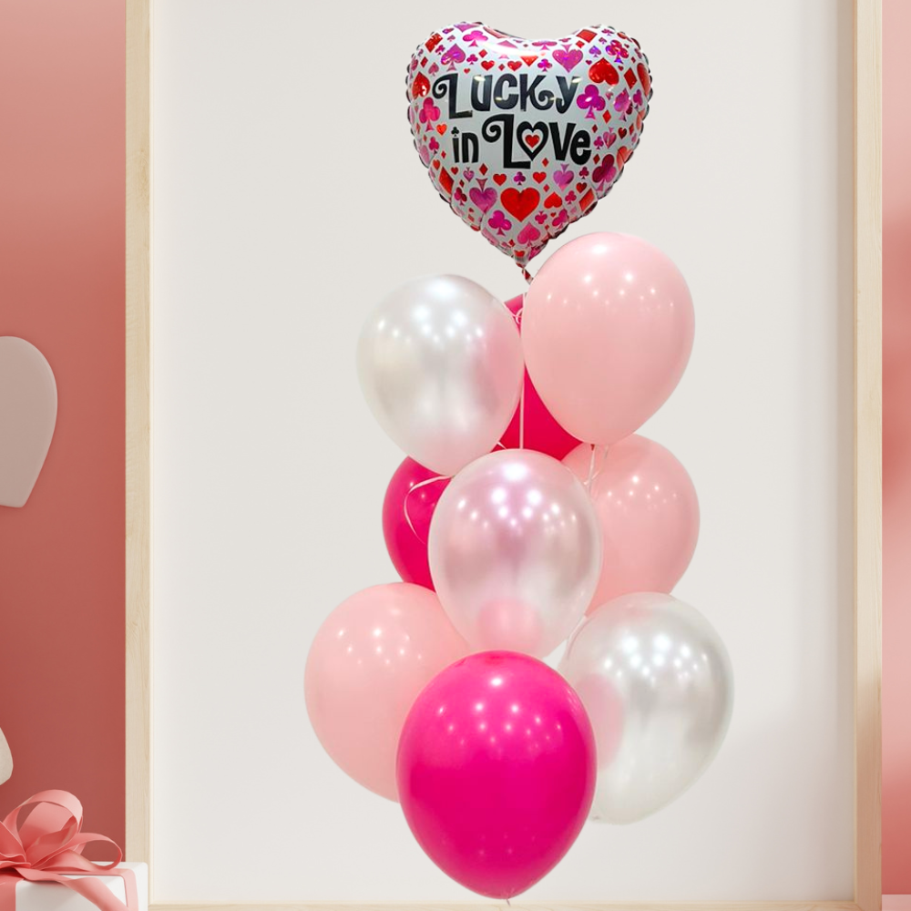 Lucky In Love Helium Balloon Bouquet featuring heart-printed foil and latex balloons, perfect for romantic celebrations or surprises.