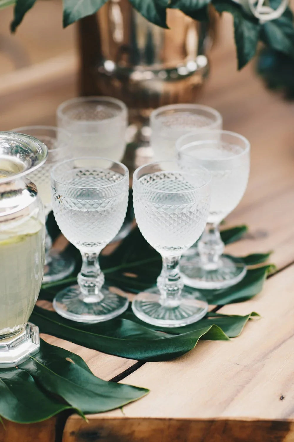Navy Blue Vintage Diamond Goblet on tropical leaf runner, part of a rustic table setting, perfect for enhancing formal or casual events.