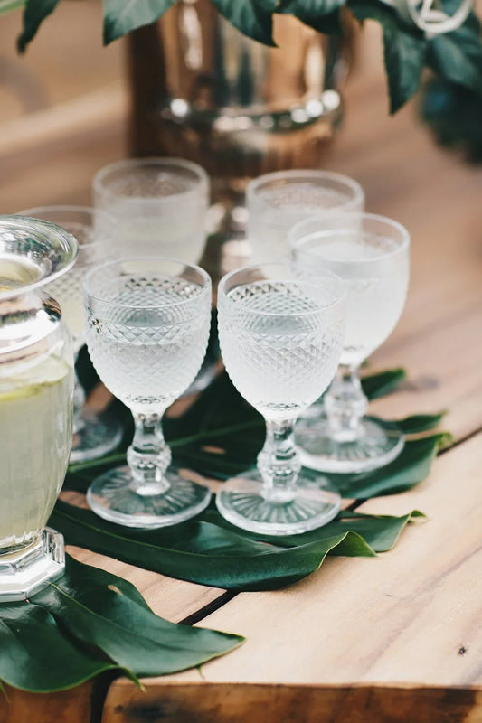 Navy Blue Vintage Diamond Goblet on tropical leaf runner, part of a rustic table setting, perfect for enhancing formal or casual events.
