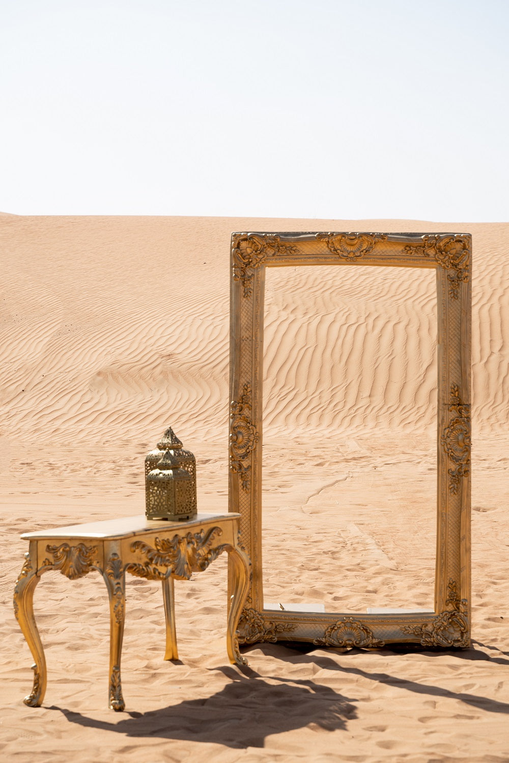 Console Unit Gold displayed in a desert setting, featuring a sleek design ideal for enhancing event spaces with a sophisticated, premium look.