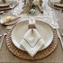 Green Lined Pure Linen Dinner Napkin - Set of 4 with green stitched border, topped by a small decorative pineapple ornament, ideal for elegant dining settings.