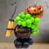 Air Filled Witch Pot Balloon Stack featuring a person-shaped sculpture with a broom and pumpkin, ideal for Halloween party decor, tabletop or floor display.