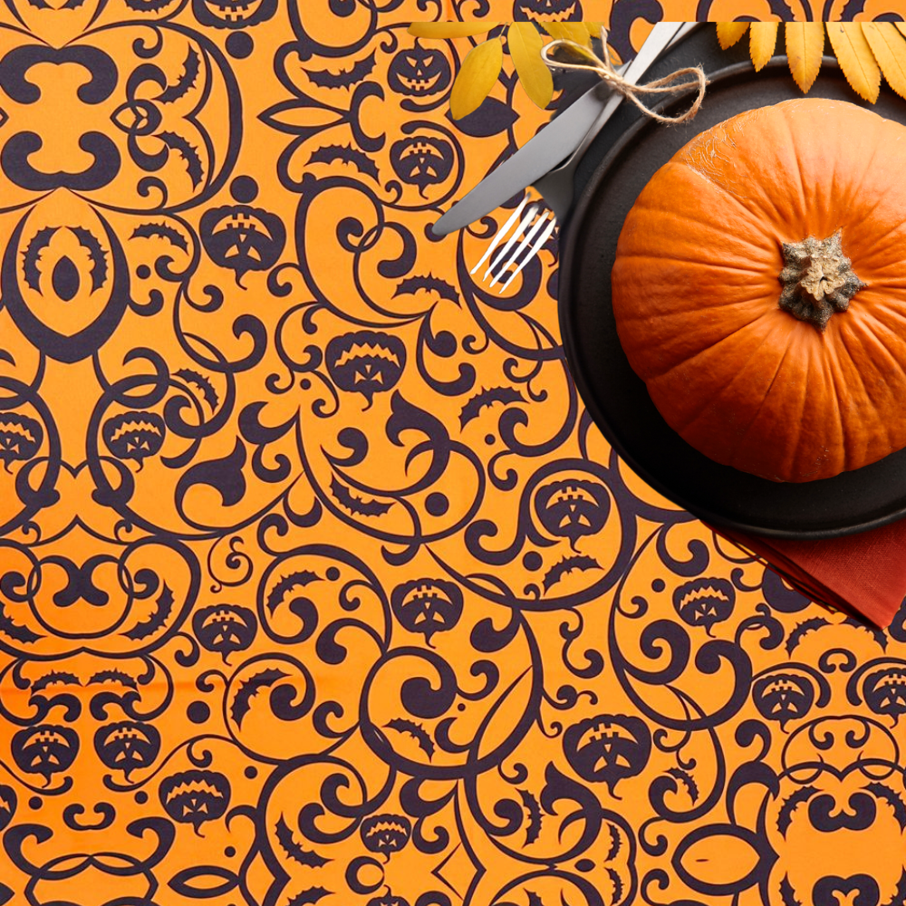 Gothic Pumpkin Polyester Halloween Tablecloth displayed with a pumpkin centerpiece, fork, and knife, ideal for unique party settings.