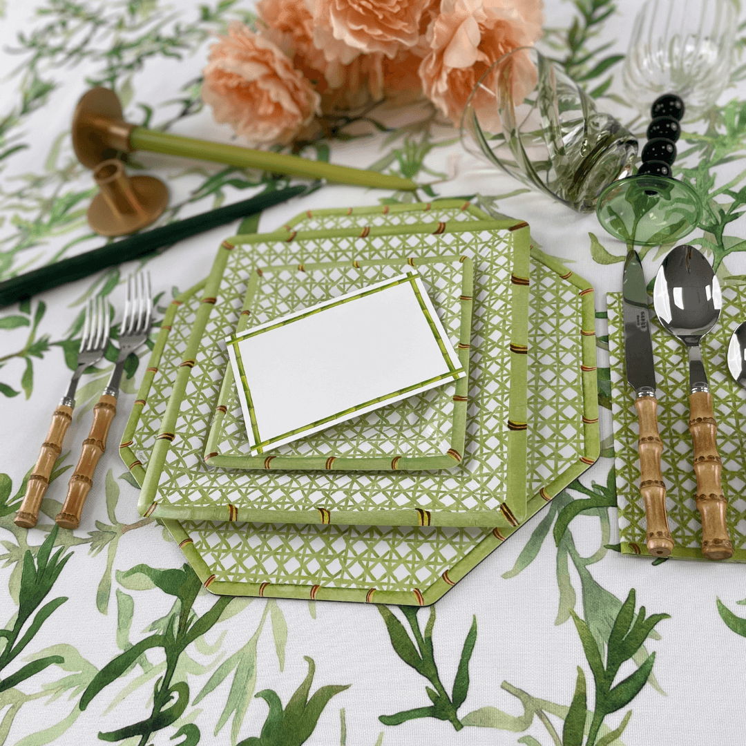 Holly Trellis Square Paper Salad &amp; Dessert Plates, set of 8, displayed on a floral table setting with matching cutlery and tablecloth.