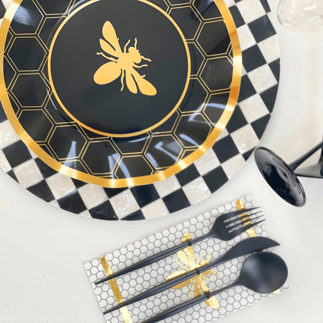 A chic round shell patterned placemat in black and white, ideal for stylish table settings. Durable, eco-friendly, and sold individually. Perfect for any event.
