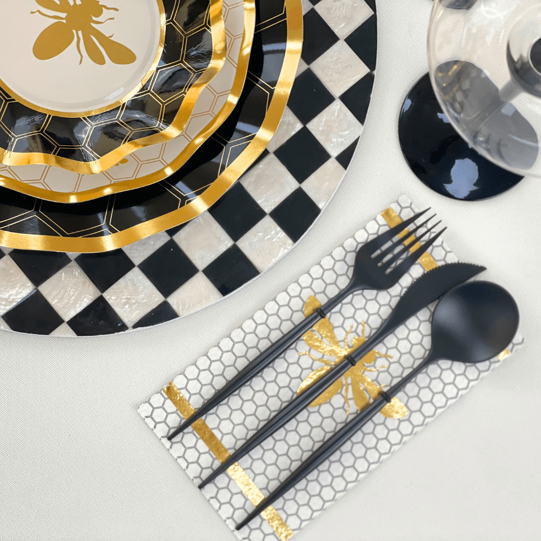 A set of elegant black cutlery, perfect for table settings. Ideal for parties and events. Includes spoon, fork, and knife. From Party Social.