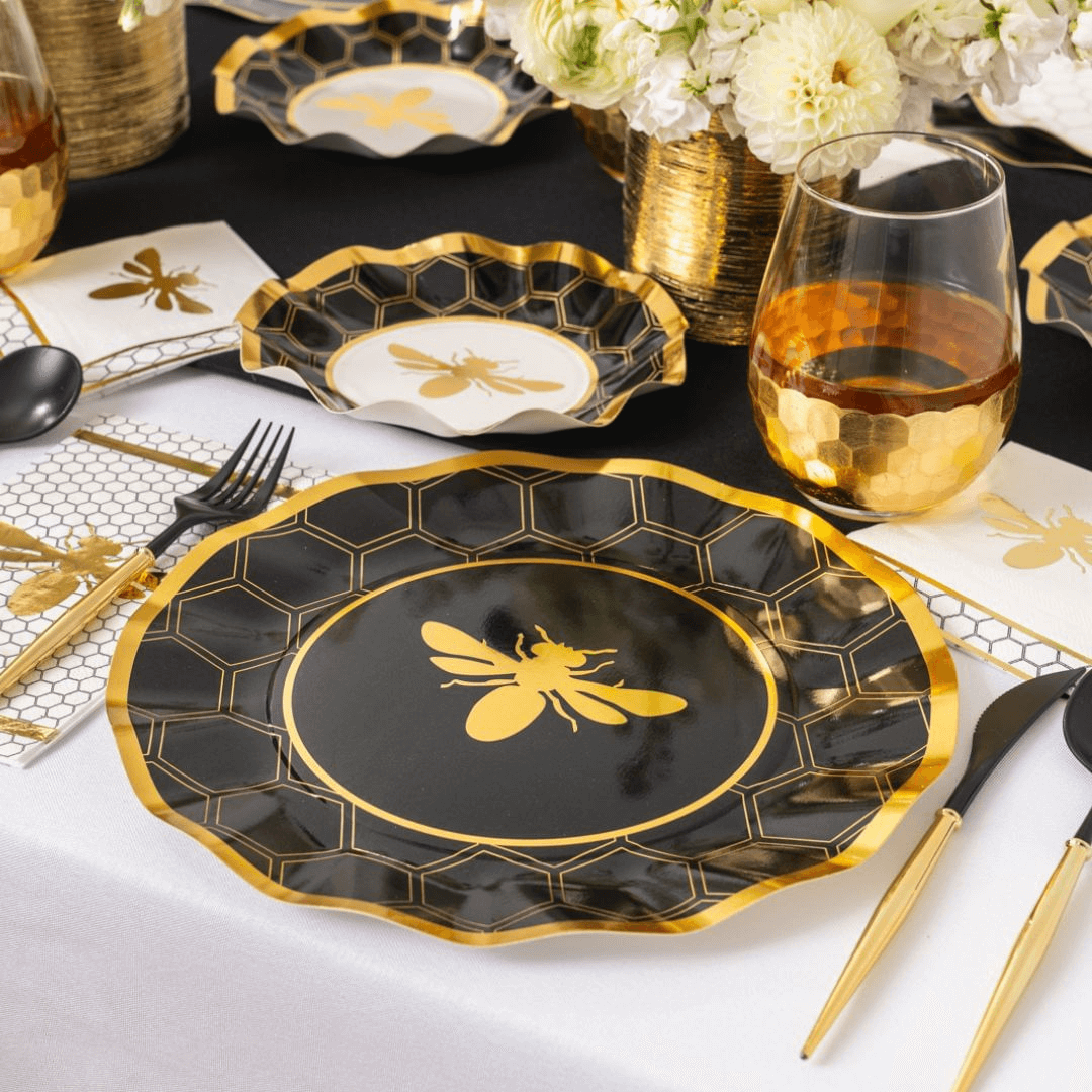 HoneyBee Paper Dinner Plate with ruffled edge, black and white design, and metallic gold rim. Adds elegance to events. 8 plates per package.